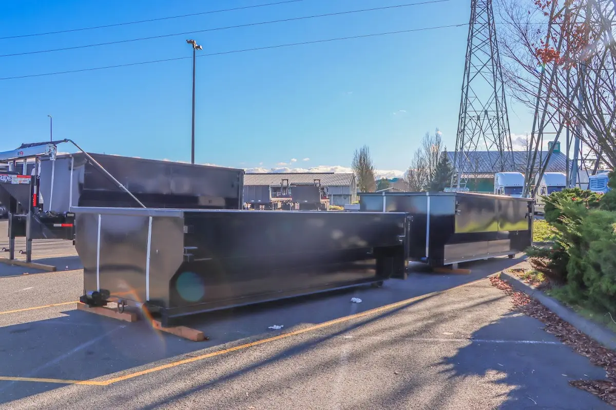 Roll-off dumpster ready for waste disposal at job site for 3 Yard Dumpster Rental in Spring Arbor